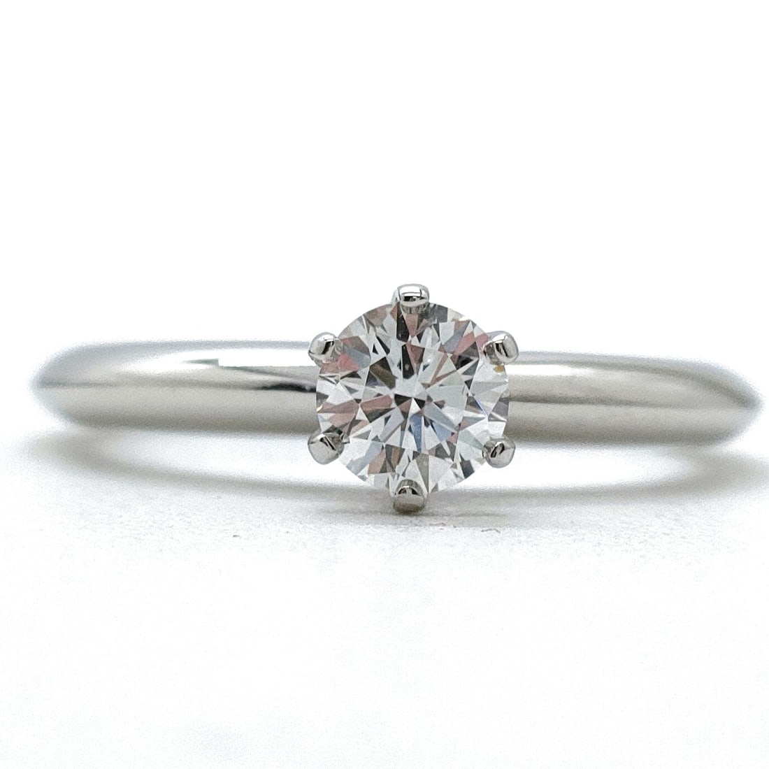 TIFFANY AND CO. RING SOLITAIRE NATURAL DIAMOND PLATINUM: Tiffany and Co. Ring Solitaire Natural Diamond Platinum Brand: Tiffany and Co. Type: Ring Material: Platinum, Color: Platinum Size: US 4 1/8 Accessories: None Accessories Notice: When purchasing