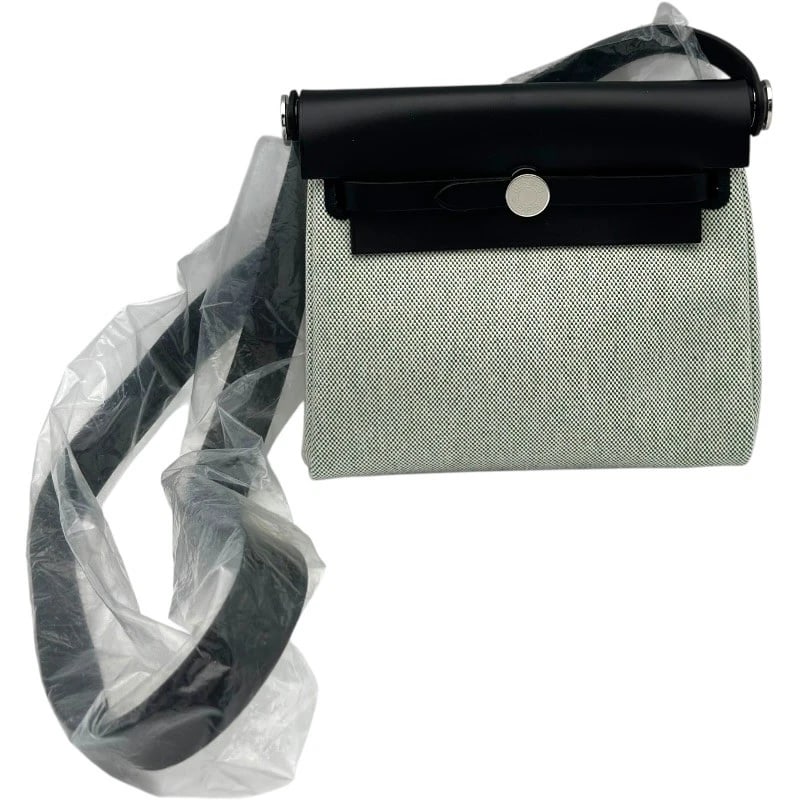 HERMES HERBAG ZIP 20 SHOULDER BAG: HERMES Herbag Zip 20 Shoulder Bag Brand: HERMES Type: Shoulder Bag Material: Toile Military Vash Hunter Color: Vert Moyen/Ecru SilverHardware Size: W18cm x H12cmx D6cm W7.1 x H4.7x D2.4inch Access