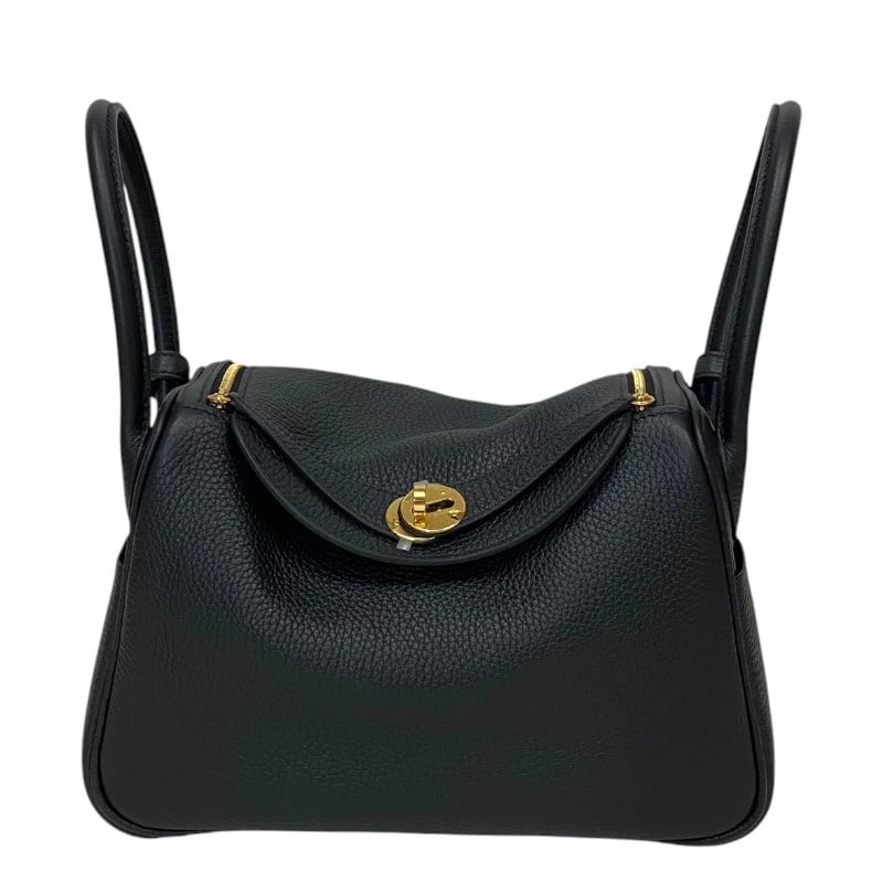 HERMES LINDY 26 HANDBAG: HERMES Lindy 26 Handbag Brand: HERMES Type: Handbag Material: Taurillon Clemence Color: Black Gold Hardware Size: W26cm x H18cmx D13cm W10.2 x H7.1x D5.1inch Accessories: None Accessories