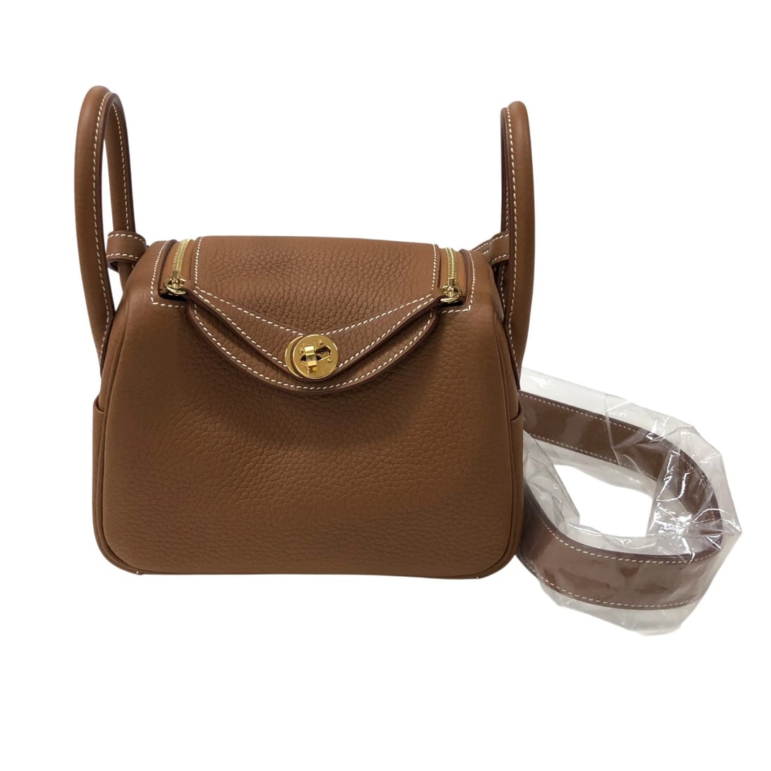HERMES LINDY MINI SHOULDER BAG: HERMES Lindy mini Shoulder Bag Brand: HERMES Type: Shoulder Bag Material: Taurillon Clemence Color: Gold Gold Hardware Size: W18cm x H13cmx D9cm W7.1 x H5.1x D3.5inch Accessories: None Acc