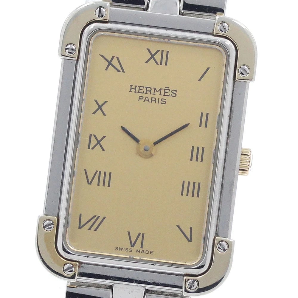 HERMES CLOJURE GOLD QUARTZ WATCH: HERMES Clojure Gold Quartz Watch Brand: HERMES Type: Wristwatch Material: Band Material Stainless Steel/Gold Plated, Case Material Stainless Steel/Gold Plated Color: Band Color Silver / Gold, Dial Col