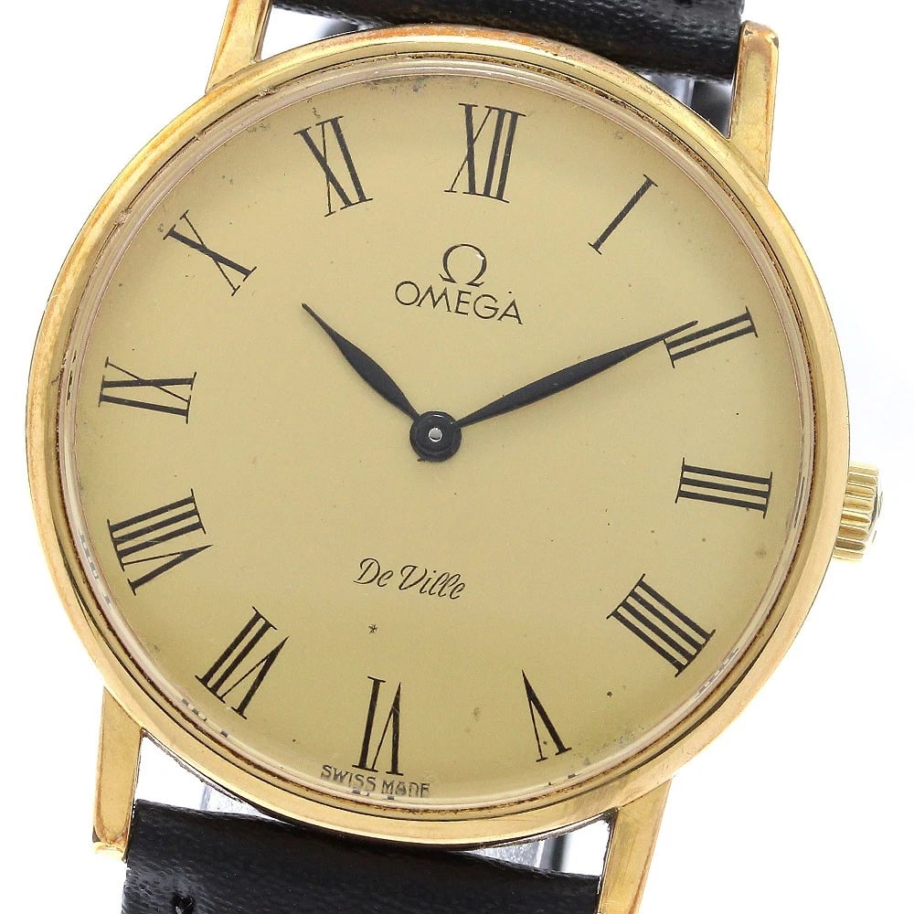 OMEGA DE VILLE GOLD WATCH: OMEGA De Ville gold Watch Brand: OMEGA Type: Wristwatch Material: Band Material leather, Case Material Stainless Steel/Gold Plated Color: Band Color black, Dial Colorgold, Case ColorGold / Silver