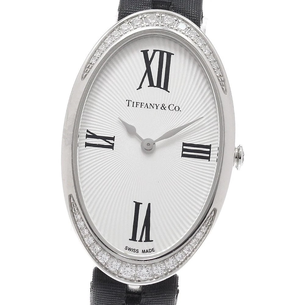 TIFFANY&COWATCH DIAMOND BEZEL SILVER QUARTZ WATCH: TIFFANY&Cowatch Diamond Bezel Silver Quartz Watch Brand: TIFFANY&Co. Type: Wristwatch Material: Band Material Leather/Satin, Case Material Stainless Steel Color: Band Color black, Dial ColorSilver, Ca