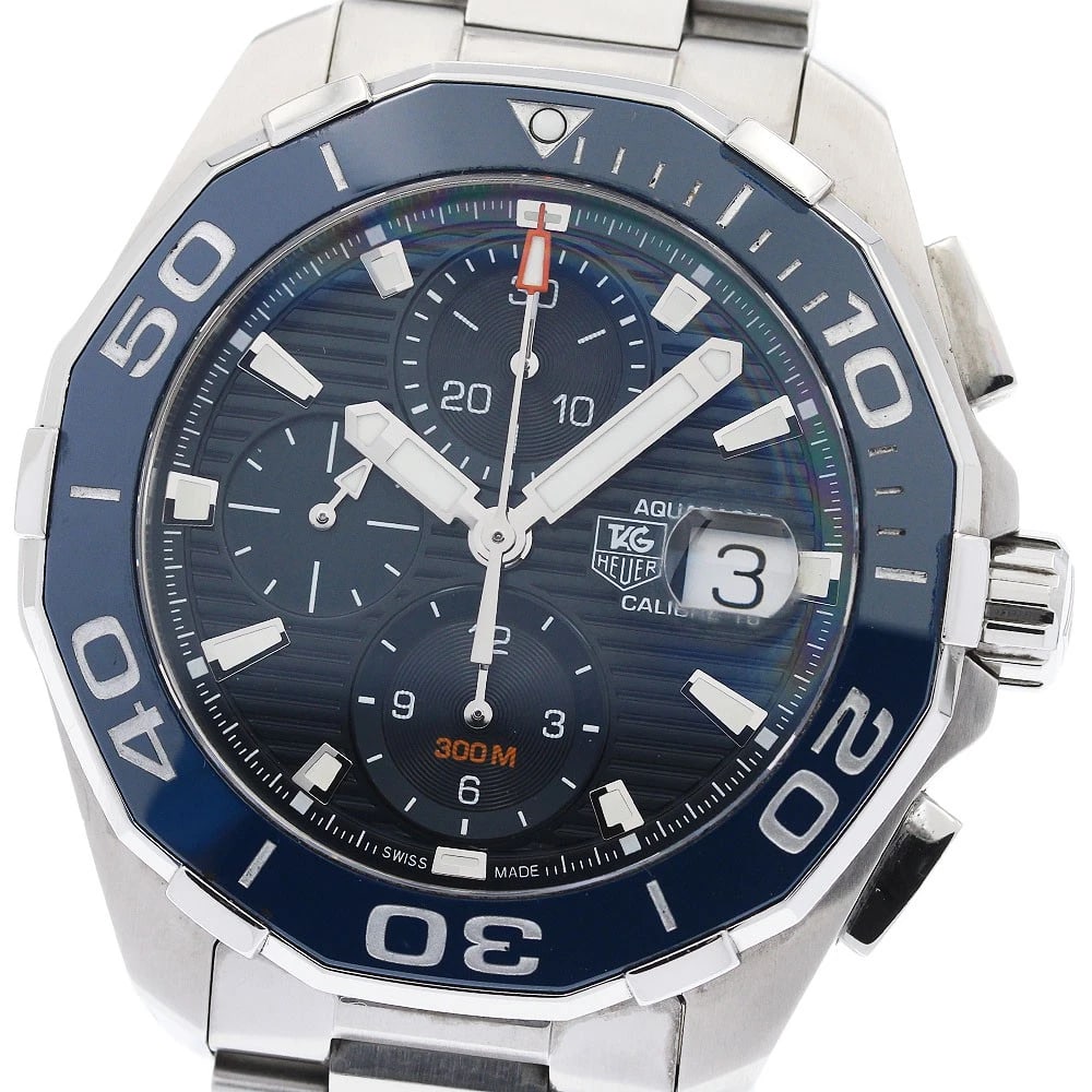 TAG HEUER AQUARACER CALIBER AUTOMATIC WATCH: TAG HEUER Aquaracer caliber Automatic Watch Brand: TAG HEUER Type: Wristwatch Material: Band Material Stainless Steel, Case Material Stainless Steel Color: Band Color Silver, Dial ColorNavy, Case Colo
