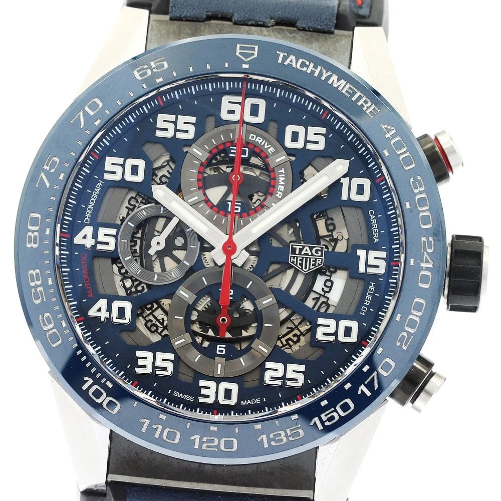 TAG HEUER CARRERA CALIBER RED BULL RACING AUTO: TAG HEUER Carrera Caliber Red bull racing Auto Brand: TAG HEUER Type: Wristwatch Material: Band Material Leather / Rubber, Case Material Stainless Steel Color: Band Color Navy / Black, Dial ColorNavy 