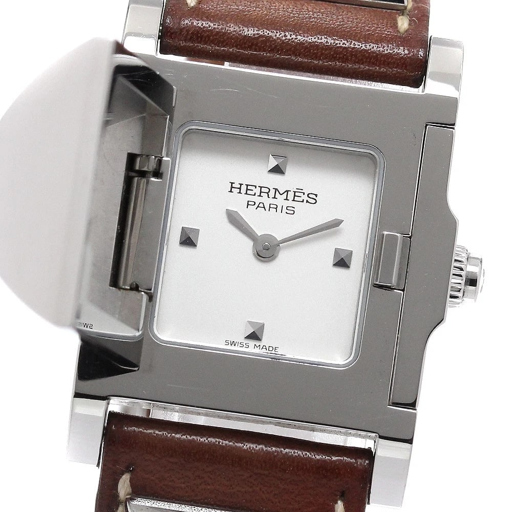 HERMES SILVER QUARTZ WATCH: HERMES Silver Quartz Watch Brand: HERMES Type: Wristwatch Material: Band Material leather, Case Material Stainless Steel Color: Band Color Brown, Dial Color Silver, Case Color Silver Size: Case Size A