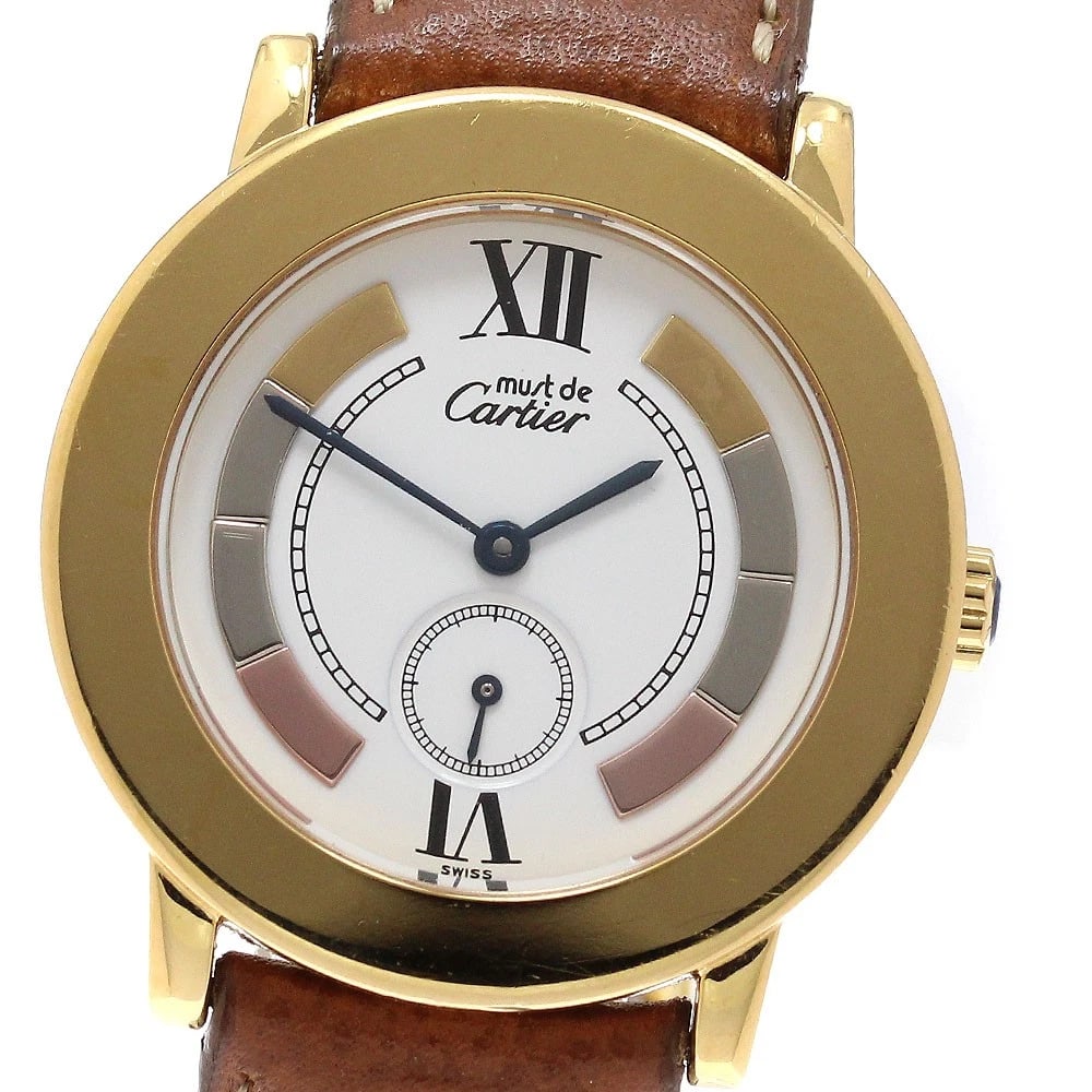 CARTIER MUSTROND VERMEIL TRINITY WHITE QUARTZ WATCH: CARTIER Mustrond Vermeil Trinity White Quartz Watch Brand: CARTIER Type: Wristwatch Material: Band Material leather, Case Material SV925/Gold Plated Color: Band Color Brown, Dial Color white, Case