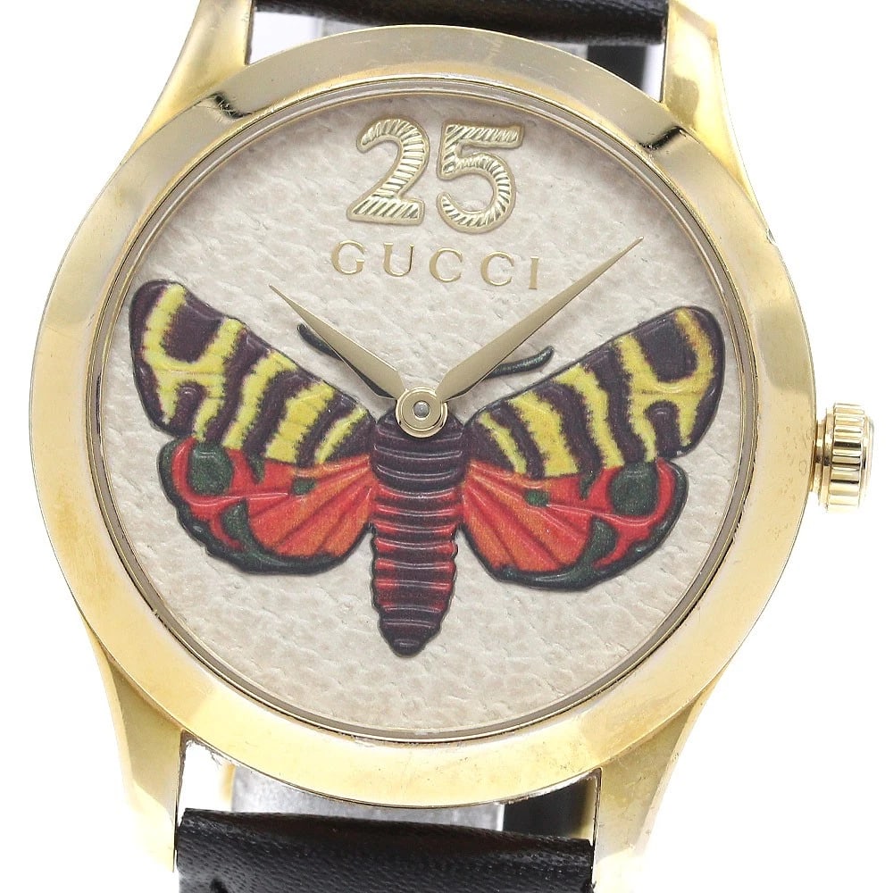 GUCCI G TIMELESS BUTTERFLY BEIGE QUARTZ WATCH: GUCCI G Timeless Butterfly beige Quartz Watch Brand: GUCCI Type: Wristwatch Material: Band Material leather, Case Material Stainless Steel/Gold Plated Color: Band Color black, Dial Color beige, Case