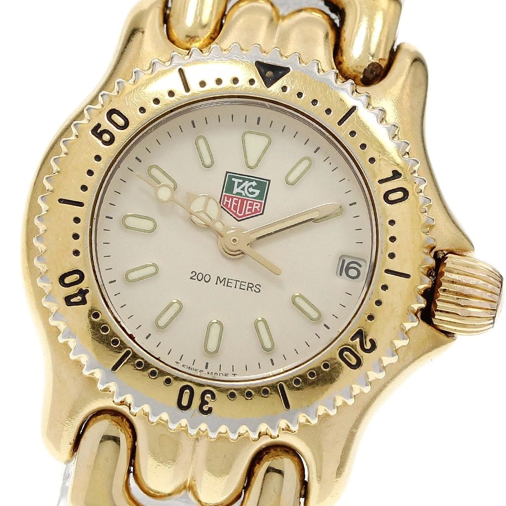 TAG HEUER DATE BEIGE QUARTZ WATCH: TAG HEUER Date beige Quartz Watch Brand: TAG HEUER Type: Wristwatch Material: Band Material Stainless Steel/Gold Plated, Case Material Stainless Steel/Gold Plated Color: Band Color Gold / Silver,