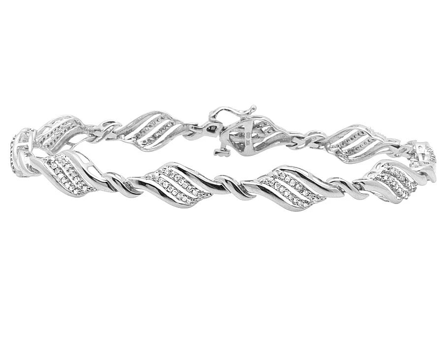 DIAMOND TWISTED DESIGNER CUSTOM BRACELET: Diamond Twisted Designer Custom Bracelet Brand: None Type/Style: Bracelet Material: 10k White Gold Color: White Gold Size: Dimension 7mm Accessories: None Accessories Notice: When purchasi