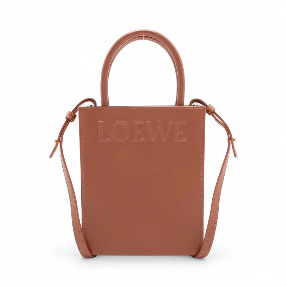 LOEWE STANDARD A5 TOTE LEATHER 2 WAY HANDBAG HANDBAG: Loewe Standard A5 tote Leather 2 Way Handbag Handbag Brand: Loewe Type/Style: Hand bag Material: Leather Color: Brown Size: Height:8.3inch Length:6.7inch Depth:2.4inch Handle height:3.7inch Access