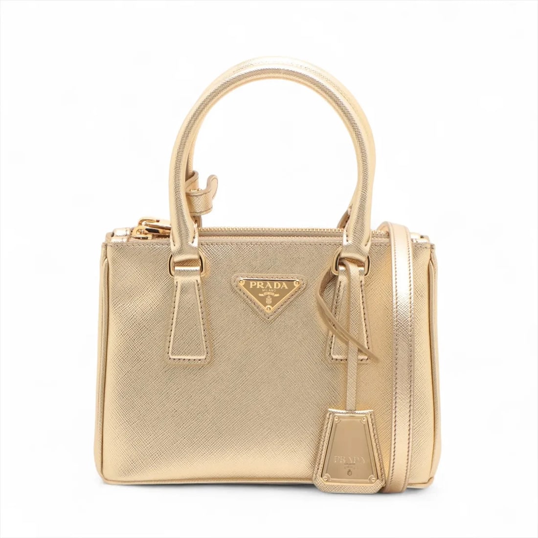 PRADA SAFFIANO LUX GALERIA LEATHER 2 WAY HANDBAG HANDBAG: Prada Saffiano Lux Galeria Leather 2 Way Handbag Handbag Brand: Prada Type/Style: Hand bag Material: Leather Color: Gold Size: Height:5.7inch Length:7.9inch Depth:3.9inch Handle height:3.9inch Acc