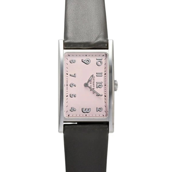 TIFFANY & CO. EAST WEST PINK DIAL QUARTZ WATCH: Tiffany & Co. East West Pink Dial Quartz Watch Brand: TIFFANY&CO. Type: Wristwatch Material: SS/Leather Color: Dial color pink Size: Case 29.0 x 22.0mm Bracelet 16.0cm Accessories: None Accessories
