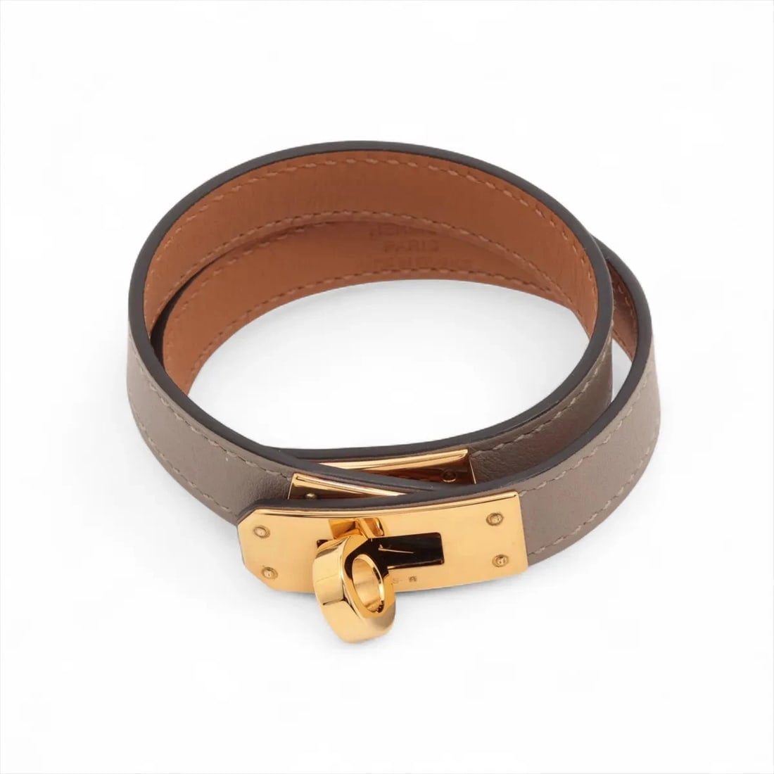 HERMES KELLY DE BOULTOUR BRACELET T3: Hermes Kelly de Boultour Bracelet T3 Brand: Hermès Type/Style: Bracelet Material: GP & Leather Color: Gold x etoupe Size: (CM) Bracelet length:15.5 (Inch) Bracelet Length:6.1inch Accessories: None
