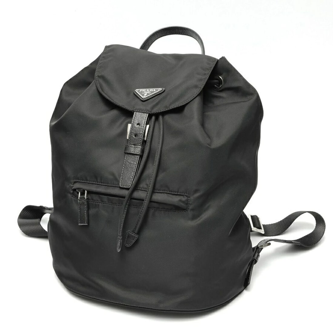 PRADA BACKPACK IN NYLON AND SAFFIANO LEATHER: Prada Backpack in Nylon and Saffiano Leather Brand: Prada Type/Style: Backpack Material: Nylon Color: Black Size: (HxWxD) 28cm x 26cm x 14.5cm / 11.02'' x 10.23'' x 5.7'' Accessories: None
