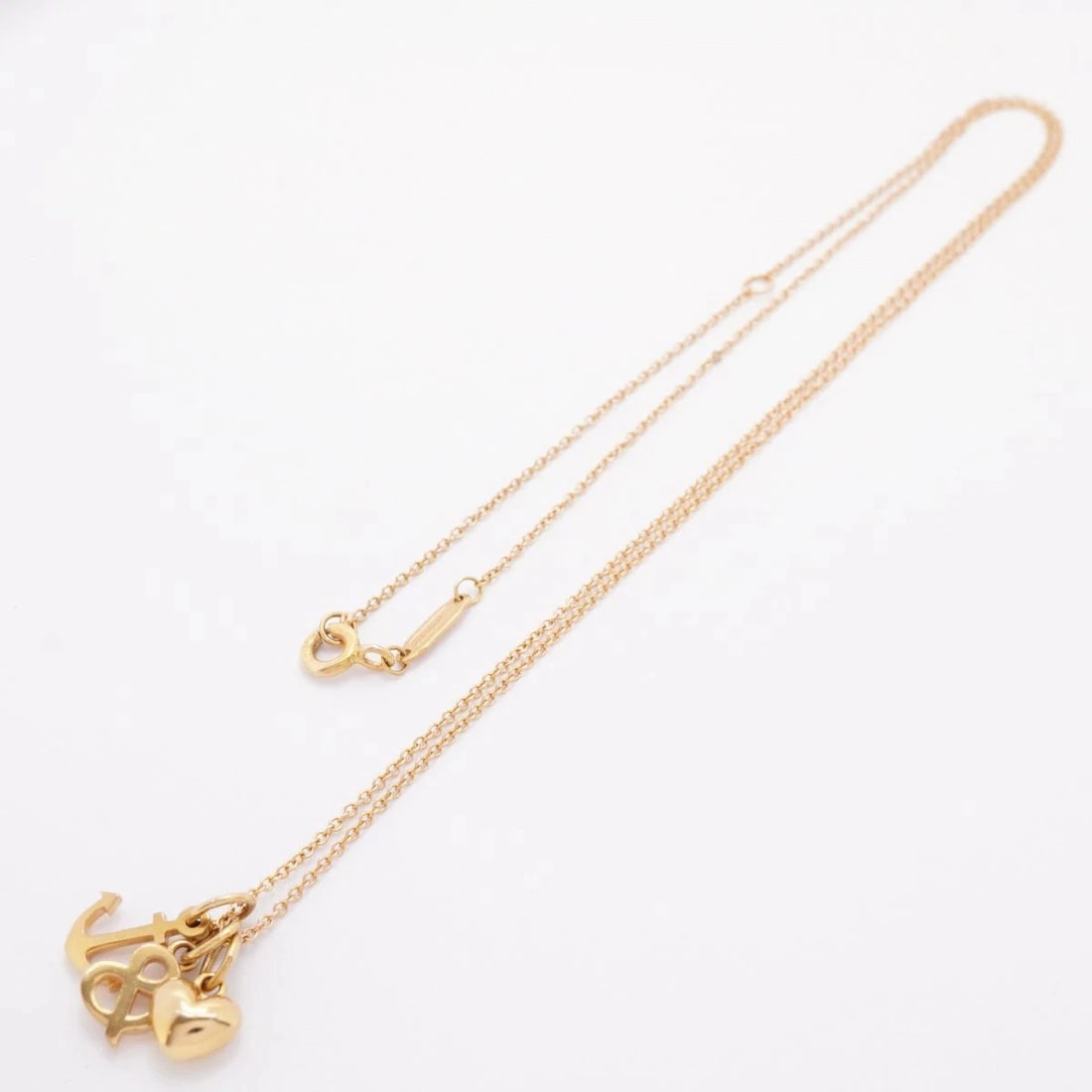 TIFFANY & CO. LOVE AND LOVE ANCHOR NECKLACE: TIFFANY & CO. LOVE AND LOVE ANCHOR NECKLACE Brand: Tiffany & Co. Type/Style: NECKLACE Material: 18K RG Color: Rose Gold Size: Neck circumference: 41cm - 46.5cm Top: W17.1mm x H14.7mm Accessories: