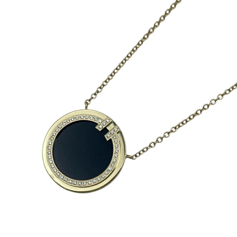TIFFANY & CO T TWO NECKLACE 18K YG ONYX DIAMOND: TIFFANY & CO T TWO NECKLACE 18K YG ONYX DIAMOND Brand: Tiffany & Co. Type/Style: NECKLACE Material: 18K YG, Main Stone/Creation ONYX Color: Yellow Gold Size: Height: Approx. 15.8mm Width: Approx. 15.8