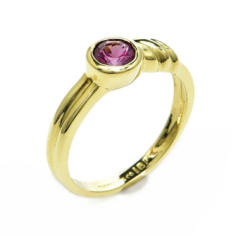 TIFFANY & CO. KNOT DESIGN RING 53 PINK TOURMALINE: TIFFANY & CO. KNOT DESIGN RING 53 PINK TOURMALINE Brand: Tiffany & Co. Type/Style: Ring Material: 18K YELLOW GOLD, Main Stone/Creation PINK TOURMALINE Color: Yellow Gold Size: US6.75 Accessories: