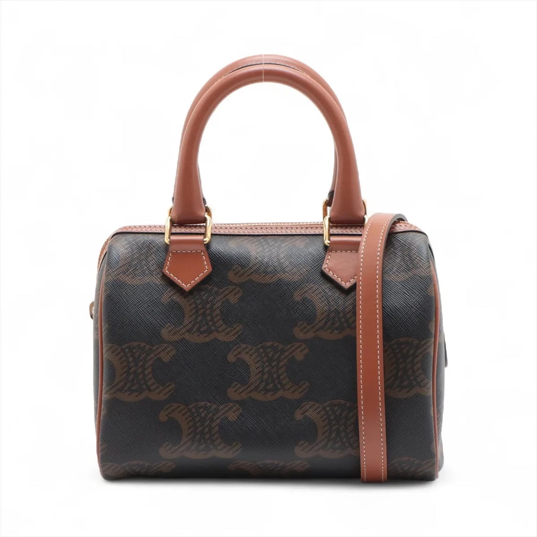 CELINE CUIR TRIOMPHE SMALL BOSTON 2 WAY HANDBAG HANDBAG: Celine Cuir Triomphe Small Boston 2 Way Handbag Handbag Brand: Celine Type/Style: Hand bag Material: PVC & leather Color: Brown Size: Height:5.5inch Length:7.7inch Depth:4.1inch Handle height:3.3inch 