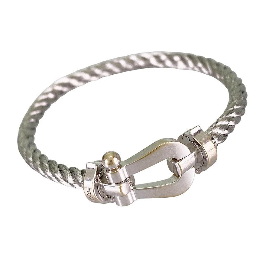 FRED WHITE GOLD BRACELET: FRED White gold Bracelet Brand: FRED Type/Style: Bracelet Material: 18K White Gold Stainless Steel Color: Silver Size: Motif size:25.1mm×12.5mm Wrist Size:17cm Spare Bracelet Size:18/18 Replacement