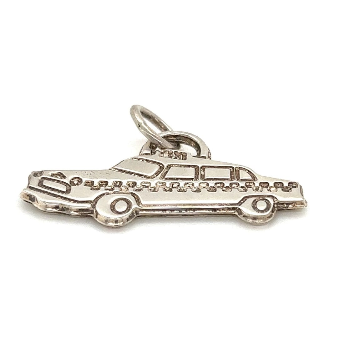 TIFFANY & CO. STERLING SILVER TAXI CHARM PENDANT: Tiffany & Co. Sterling Silver Taxi Charm Pendant Brand: Tiffany & Co. Type/Style: Pendant Material: 925 sterling silver Color: silver Size: Measurement: 1.06" tall w/bail x 1.45" Accessories: None