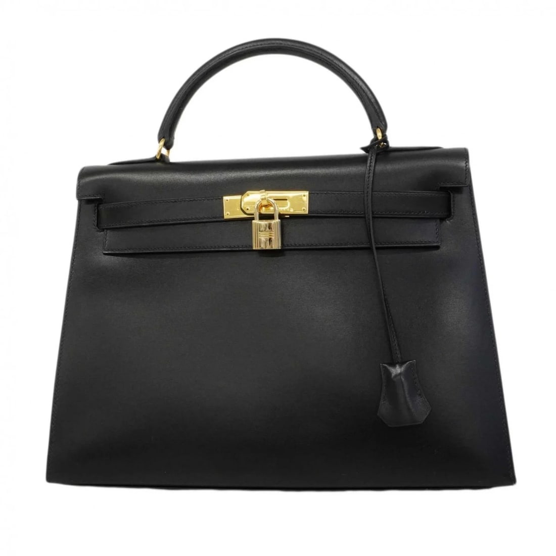 HERMES KELLY 32 HANDBAG, BOX CALF LEATHER: Hermes Kelly 32 Handbag, Box Calf Leather Brand: Hermes Type/Style: Handbag Material: Box calf leather Color: Black Size: (HxWxD) 23cm x 32.5cm x 12cm / 9.05'' x 12.79'' x 4.72'' Accessories: None