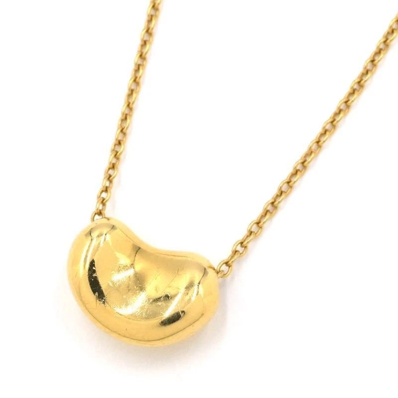 TIFFANY & CO. BEAN DESIGN PENDANT: Tiffany & Co. Bean Design Pendant Brand: Tiffany & Co. Type/Style: Pendant Material: K18YG Color: YG Size: Effective length 43cm Chain width 0.7mm Motif 10.5mm x 7.3mm Accessories: None Accessories