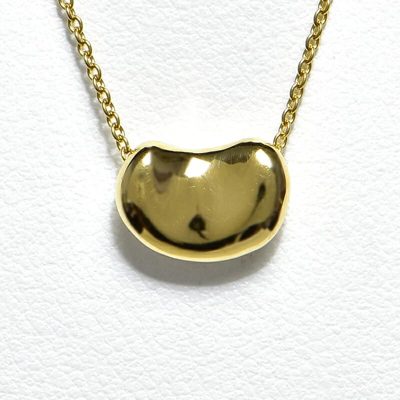 TIFFANY & CO. BEAN DESIGN PENDANT 18K: Tiffany & Co. Bean Design Pendant 18K Brand: Tiffany & Co. Type/Style: Pendant Material: K18YG Color: YG Size: Effective length 40cm Chain width 1.0mm Motif 11.0mm x 7.9mm Accessories: None