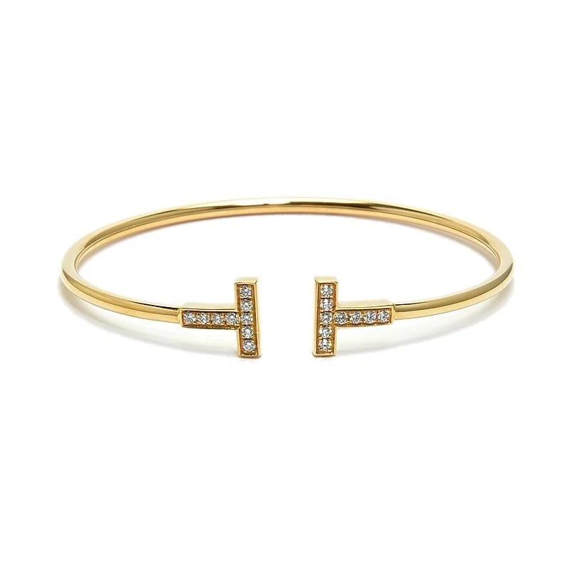 TIFFANY & CO. DIAMOND WIRE BRACELET: Tiffany & Co. Diamond Wire Bracelet Brand: Tiffany & Co. Type/Style: Bracelet Material: K18RG Color: RG Size: Inner circumference 15.9cm Width 2.3mm Motif 9.9mm x 10.3mm Accessories: None Accessories