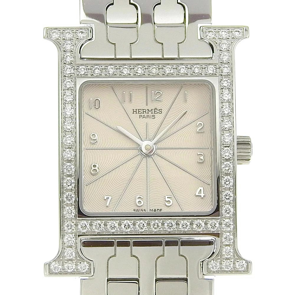 HERMES H WATCH DIAMOND BEZEL QUARTZ IVORY DIAL WATCH: Hermes H Watch Diamond Bezel Quartz Ivory Dial Watch Brand: HERMES Type: Wristwatch Material: Stainless Steel (Diamonds) / Leather Color: Dial color Ivory Size: Case: Approximately H30mm x W21mm (incl
