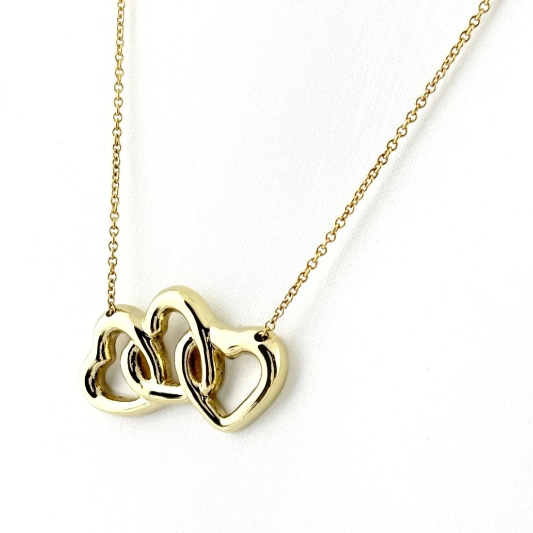 TIFFANY&CO. TRIPLE HEART YELLOWGOLD PENDANT NECKLACE: TIFFANY&Co. Triple Heart YellowGold Pendant Necklace Brand: Unbranded Type/Style: Necklace Material: 750, Main Stone/Creation Natural Color: Size: Chain / code 45cm(17.7") Pendant head Removable Not