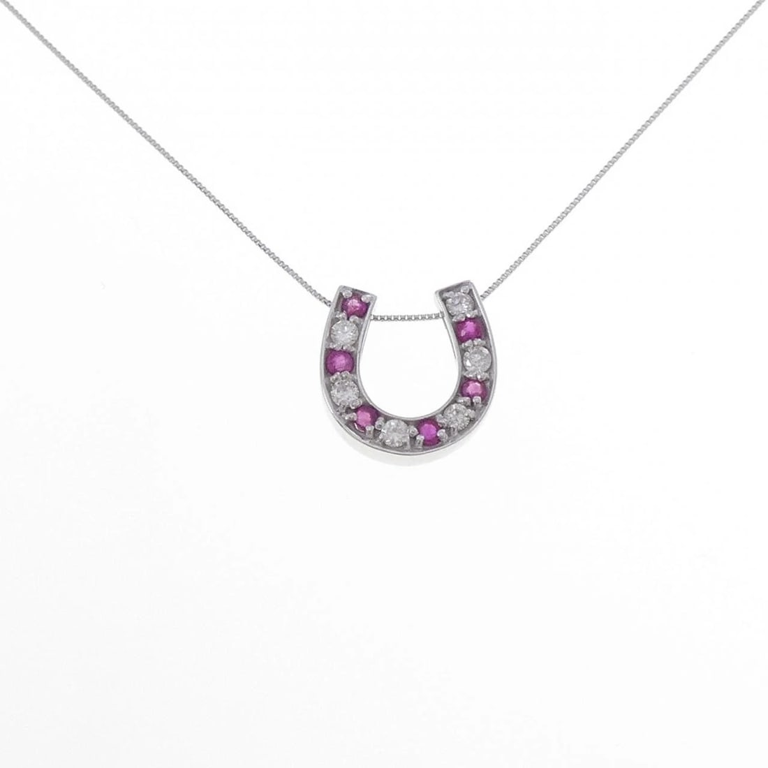 K18WG HORSESHOE RUBY NECKLACE: K18WG Horseshoe Ruby Necklace Brand: Unbranded Type/Style: Ruby Necklace Material: 18k White Gold, Main Stone/Creation Ruby Secondary Stone Diamond Color: White Gold Size: Pendant length approx. x