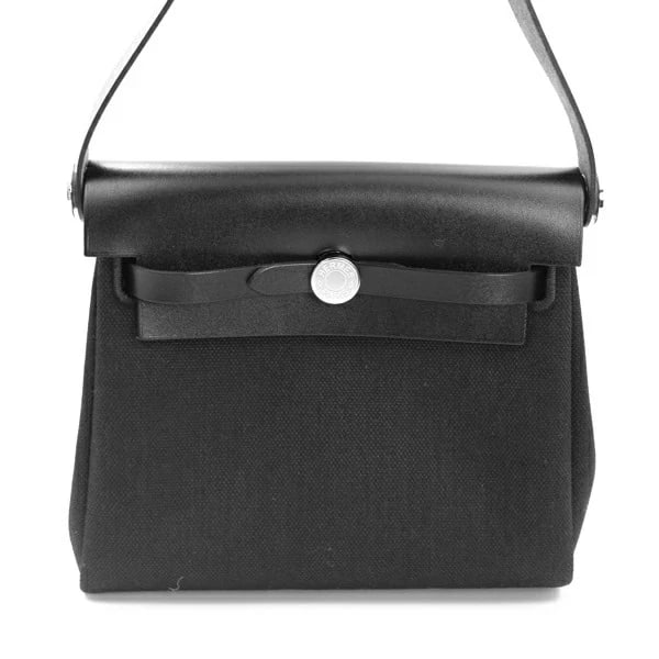 HERMES EVELYNE BAG ZIP MINI / VACHE HUNTER BLACK G STAMP: Hermes Evelyne Bag Zip Mini / Vache Hunter Black G Stamp Brand: Hermes Type/Style: Handbag Material: Toile Military/Vash Hunter Color: Black Size: W:20cm ? H:16.5cm ? D:6.5cm Accessories: None