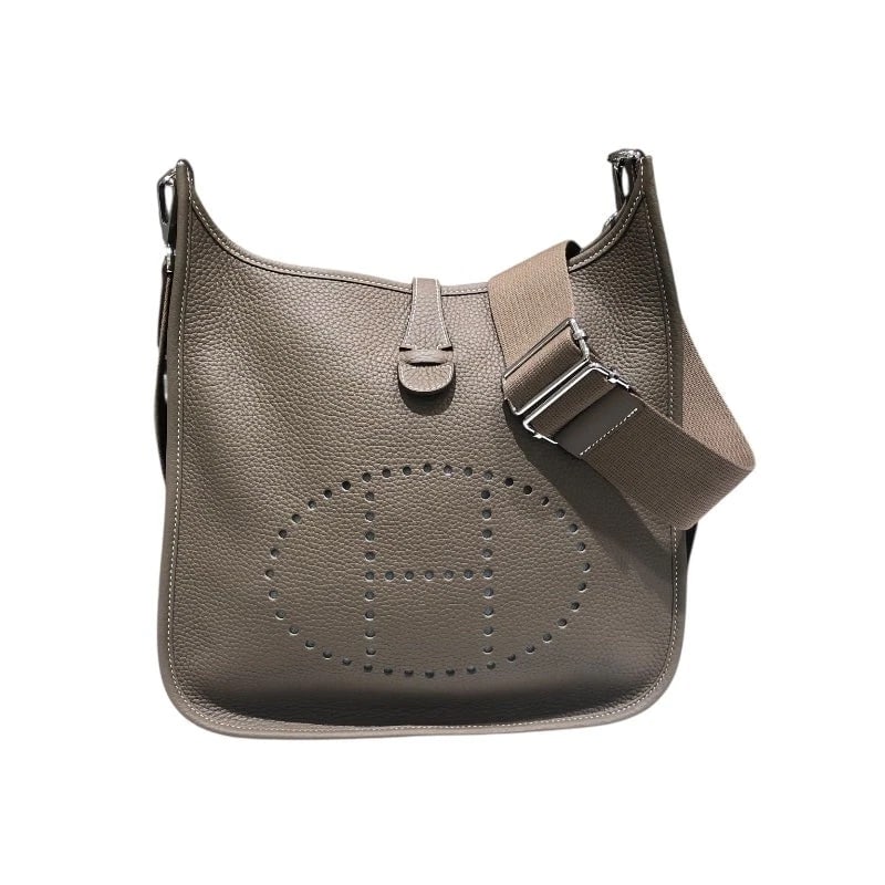 HERMES EVELYNE PM ETOUPE CLEMENCE LEATHER SHOULDER BAG: Hermes Evelyne PM Etoupe Clemence Leather Shoulder Bag Brand: HERMES Type/Style: Handbag Material: Taurillon Color: Etoupe / SV Hardware Size: W: 25cm / H: 26cm / D: 8cm Accessories: None