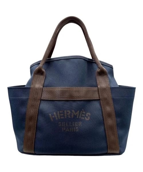 HERMES SAC DE PANSAGE GROOM NAVY AND ORANGE: HERMES Sac de Pansage Groom Navy and Orange Brand: HERMES Type/Style: Handbag Material: Polyamide,Cotton,Polyurethane Color: Navy With Silver Hardware Size: H:34.0cm / W:38.0cm / D:16.5cm
