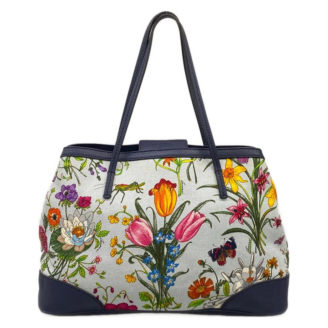 GUCCI FLORA LIGHT BLUE NAVY MULTI CANVAS LEATHERTOTE BAG: GUCCI Flora Light Blue Navy Multi Canvas LeatherTote Bag Brand: GUCCI Type/Style: Tote Bag Material: Exterior Material Canvas, Leather Color: Exterior Color Light Blue, Navy, Multi Size: Height : 9.45