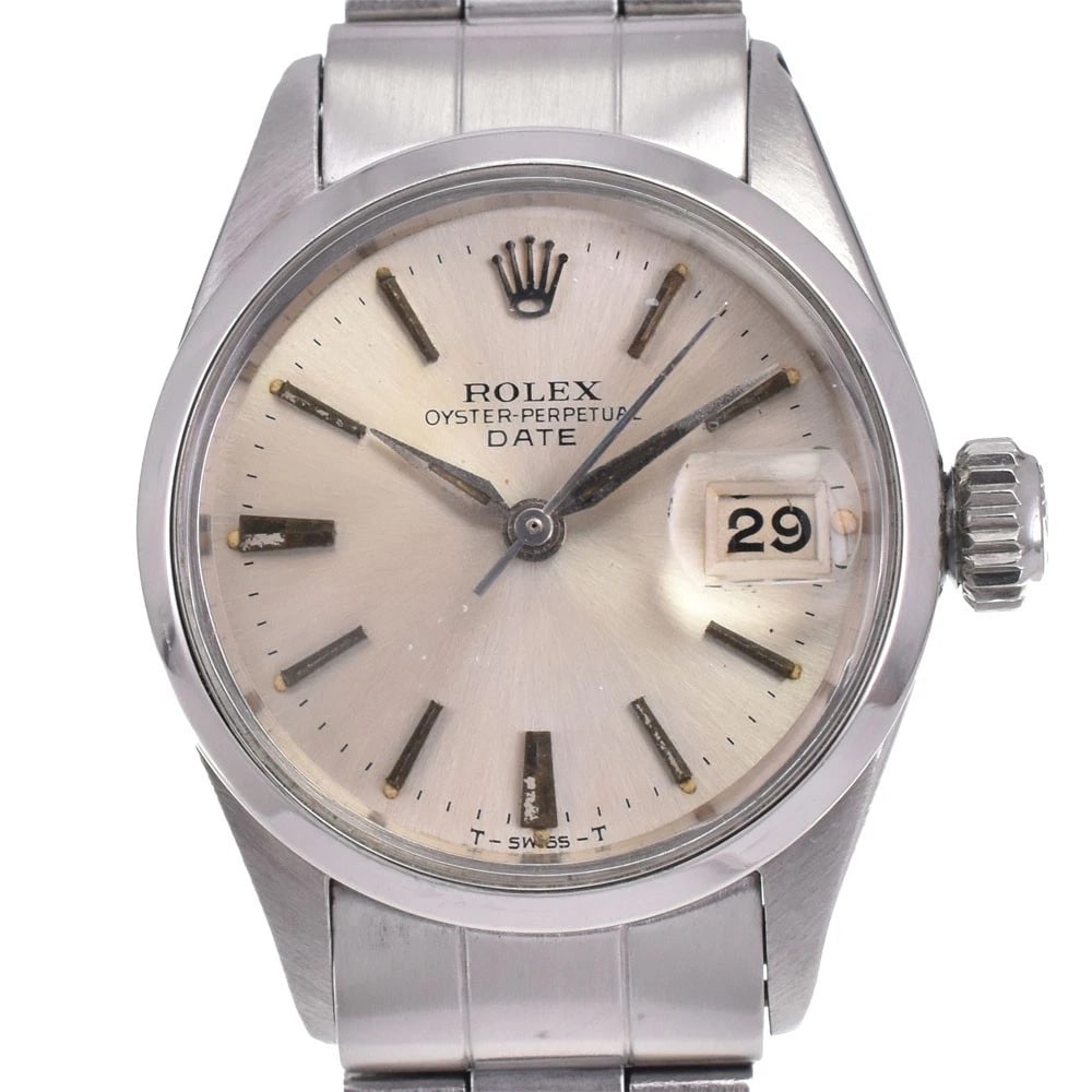 ROLEX OYSTER PERPETUAL DATE LADIES WATCH: ROLEX Oyster Perpetual Date Ladies Watch Brand: ROLEX Type/Style: Wristwatch Material: Band Material Stainless Steel, Case Material Stainless Steel Color: Band Color Silver, Dial Color Silver, Case Co