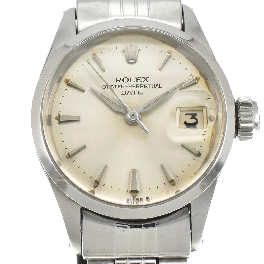 ROLEX OYSTER PERPETUAL DATE LADIES WATCH: ROLEX Oyster Perpetual Date Ladies Watch Brand: ROLEX Type/Style: Wristwatch Material: Band Material Stainless Steel, Case Material Stainless Steel Color: Band Color Silver, Dial Color Silver, Case Co