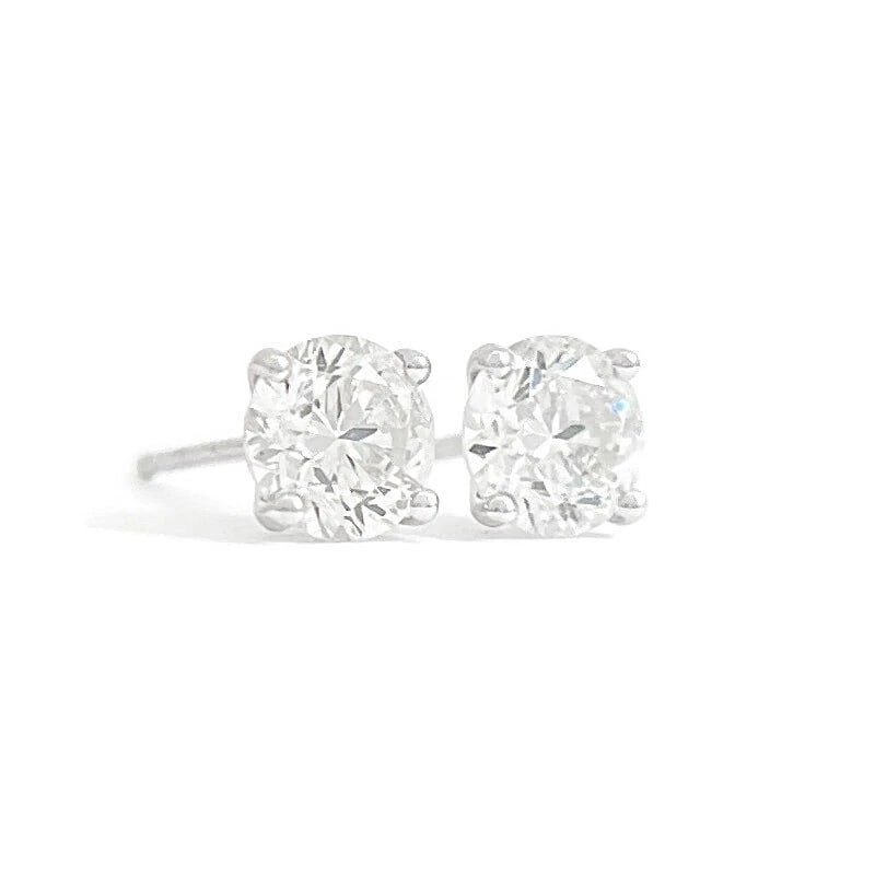 ROUND DIAMOND STUD EARRINGS 14K WHITE GOLD: Round Diamond Stud Earrings 14K White Gold Brand: Unbranded Type/Style: Earrings Material: 14K White Gold, Main Stone/Creation Natural Color: Silver Size: Measurements: 5.15 mm - 5.25 mm Accessories:
