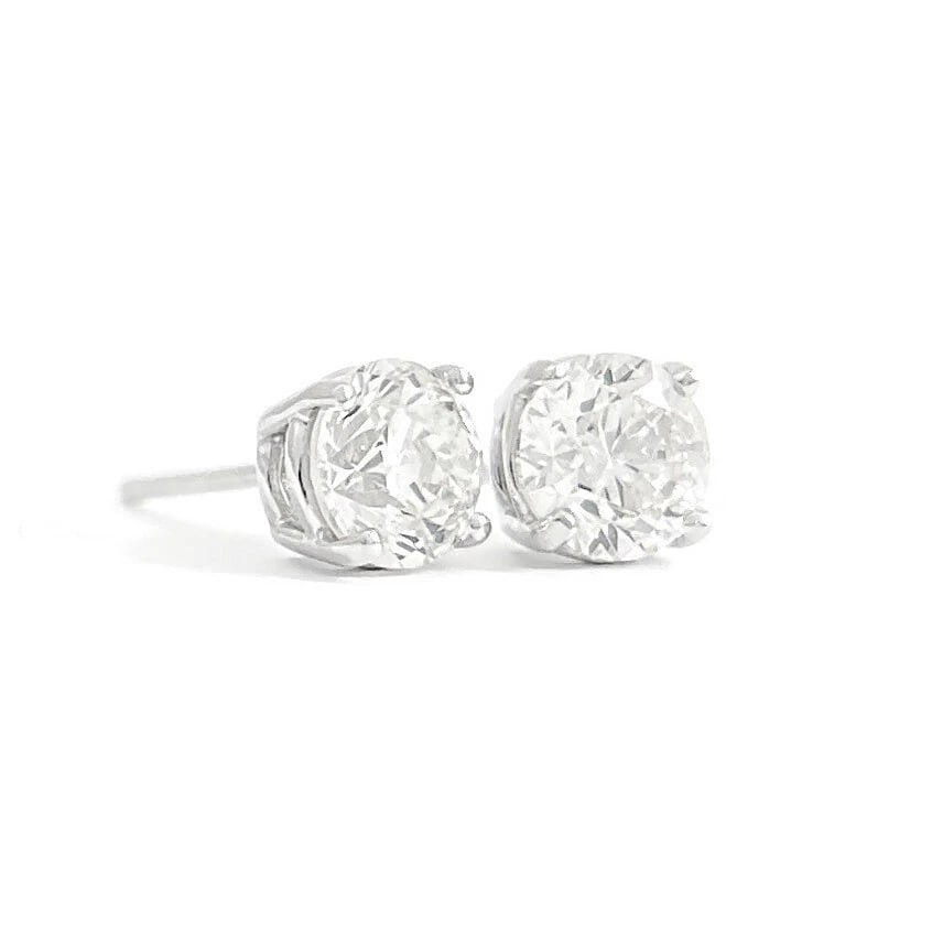 ROUND DIAMOND STUD EARRINGS 14K WHITE GOLD: Round Diamond Stud Earrings 14K White Gold Brand: Unbranded Type/Style: Earrings Material: 14K White Gold, Main Stone/Creation Natural Color: Silver Size: Measurements: 5.4 mm - 5.5 mm Accessories: