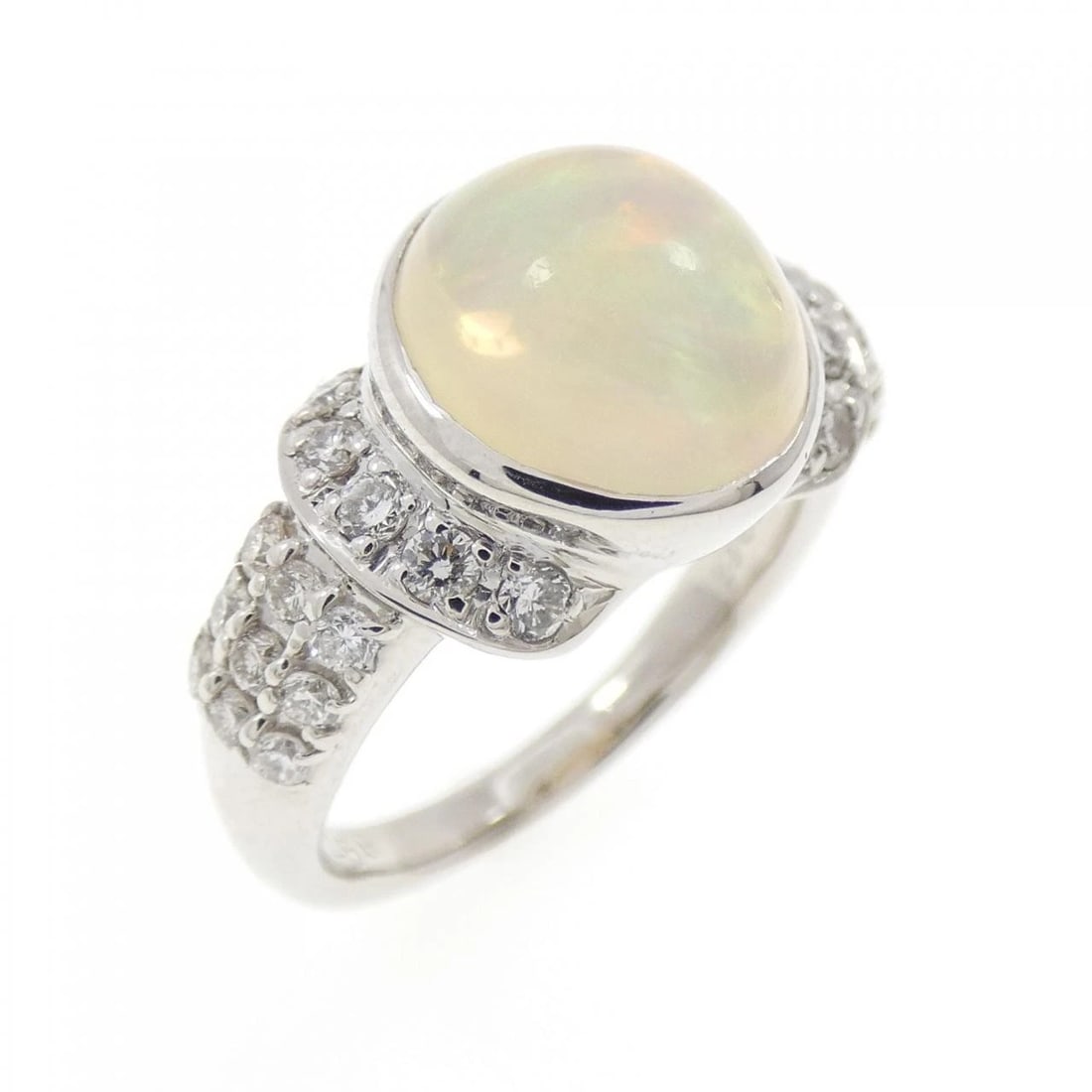 PT900 OPAL RING: PT900 Opal Ring Brand: Unbranded Type/Style: Opal Ring Material: Platinum900, Main Stone/Creation Opal Secondary Stone Diamond Color: Platinum Size: US 5 3/4 Accessories: None Accessories Notice: