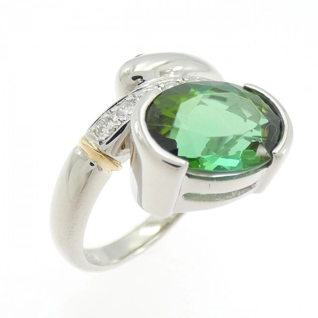 PT900/K18YG TOURMALINE RING: PT900/K18YG Tourmaline Ring Brand: Unbranded Type/Style: Tourmaline Ring Material: Platinum90018K Yellow Gold, Main Stone/Creation Tourmaline Secondary Stone Ruby Diamond Color: Platinum Size: US 6