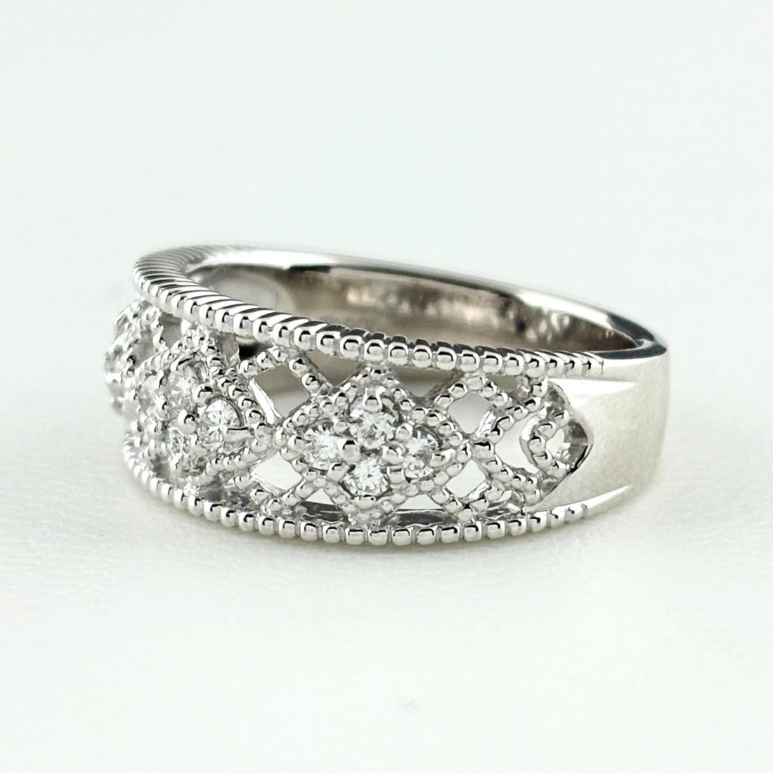 MELEE DIAMOND DESIGN PLATINUM RING - 3