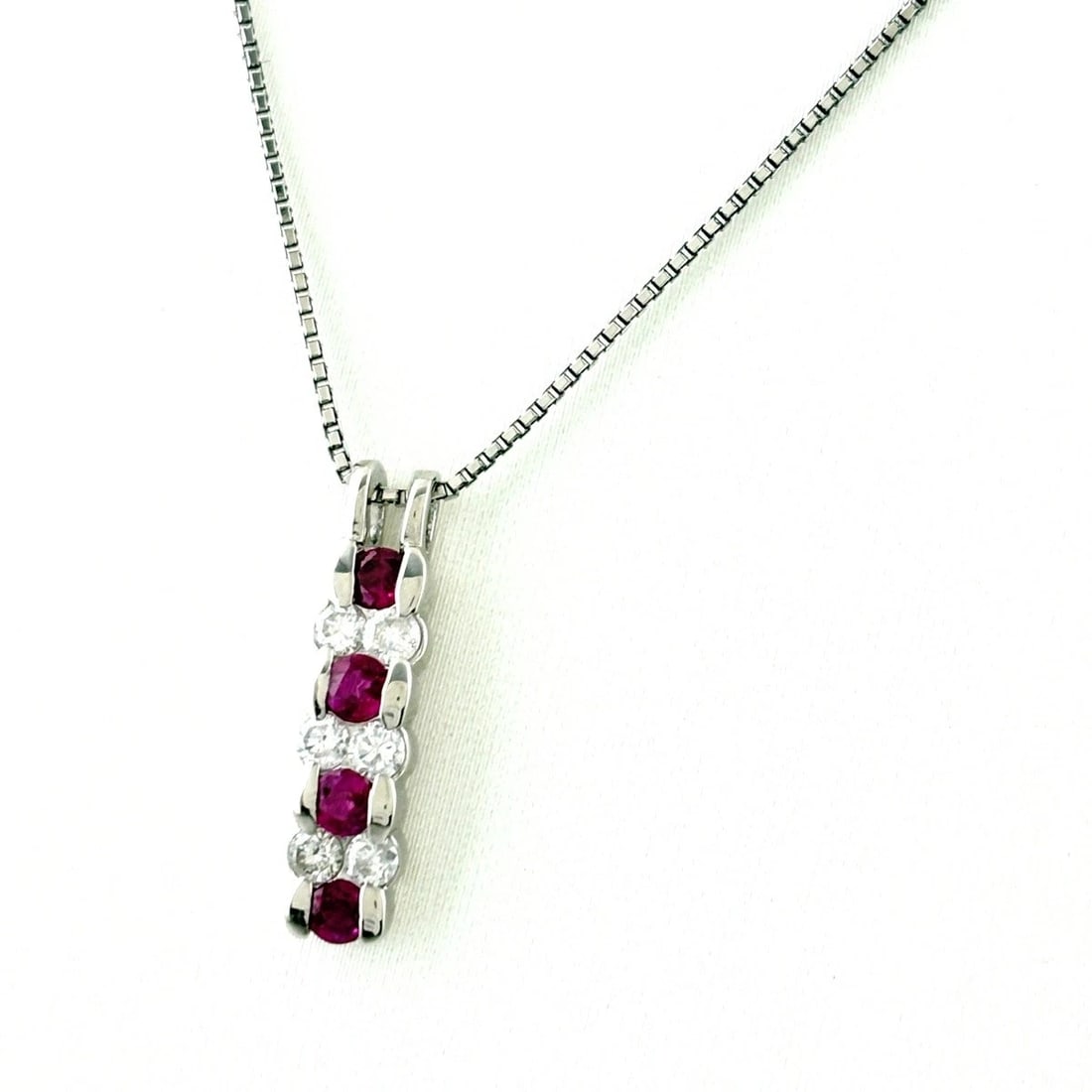 RUBY DESIGN PLATINUM PENDANT MELEE DIAMOND NECKLACE: Ruby Design Platinum Pendant melee diamond Necklace Brand: Unbranded Type/Style: Necklace Material: Pt900 Pt850, Main Stone/Creation Ruby Diamond Color: None Size: Chain width 0.8mm(0.0") Total length