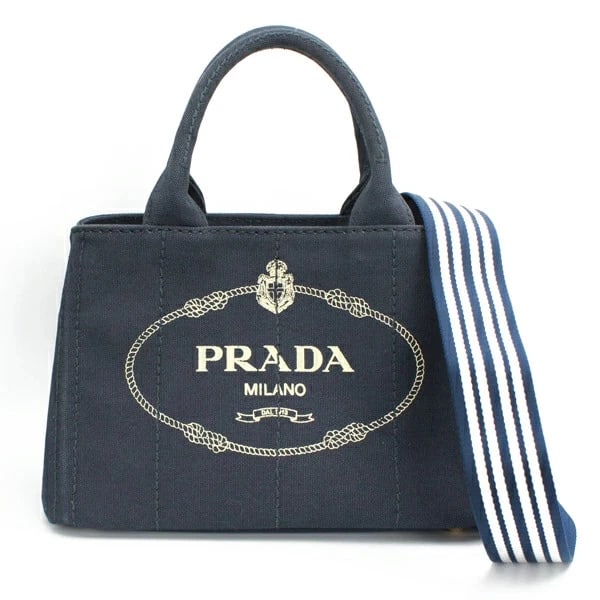 PRADA CANAPA 2-WAY TOTE BAG COTTON: Prada Canapa 2-Way Tote Bag Cotton Brand: Prada Type/Style: Handbag Material: Cotton Canvas Color: Navy Size: W:29cm ? H:20cm ? D:14cm Accessories: None Accessories Notice: When purchasing pre-owned