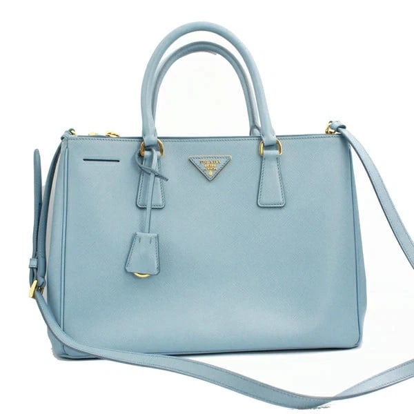 PRADA GALLERIA SAFFIANO LEATHER LARGE BAG IN ASTRALE: Prada Galleria Saffiano Leather Large Bag in Astrale Brand: Prada Type/Style: Handbag Material: Saffiano Leather Color: Blue Size: W:34cm ? H:24.5cm ? D:14.5cm Accessories: None Accessories Notice:
