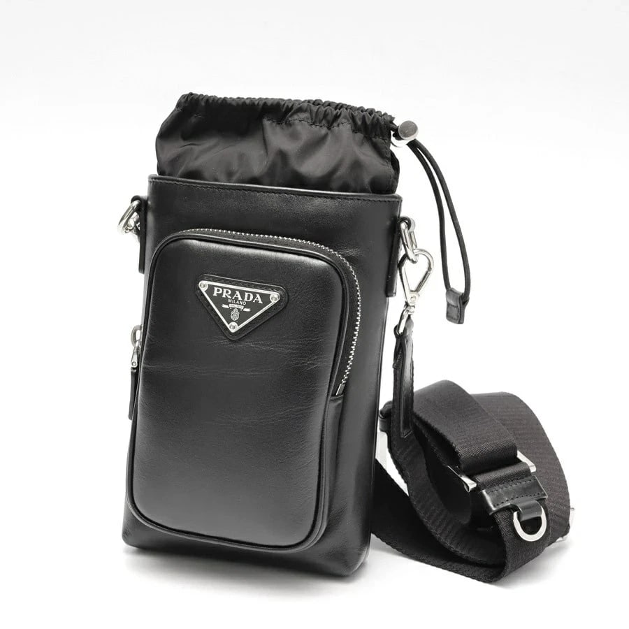 PRADA SMARTPHONE CASE SHOULDER POUCH: Prada Smartphone Case Shoulder Pouch Brand: Prada Type/Style: Bag Material: Leather Color: Black Size: W13?H18?D5cm Accessories: None Accessories Notice: When purchasing pre-owned goods, please refer