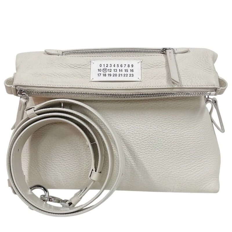 MAISON MARGIELA SHOULDER BAG IVORY SHOULDER BAG: Maison Margiela Shoulder Bag Ivory Shoulder Bag Brand: Maison Margiela Type/Style: Handbag Material: Leather Color: ivory Size: W: 30cm / H: 20cm / D: 10cm Accessories: None Accessories Notice: When