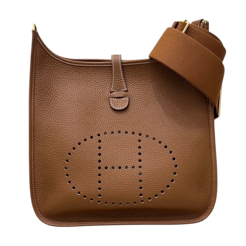 HERMES EVELYNE GOLD TAURILLON SHOULDER BAG: Hermes Evelyne Gold Taurillon Shoulder Bag Brand: HERMES Type/Style: Handbag Material: Taurillon Color: gold Size: W: 28cm / H: 30cm / D: 8cm Accessories: None Accessories Notice: When purchasing