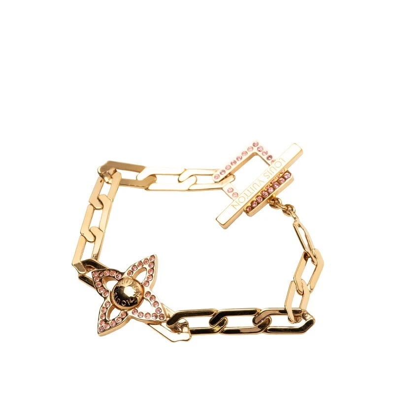 LOUIS VUITTON BRACELET GOLD PLATED RHINESTONES: Louis Vuitton Bracelet Gold Plated Rhinestones Brand: Louis Vuitton Type/Style: Bracelet Material: Plated metal, Rhinestones, Color: Gold Size: Width approximately 0.83 inches Accessories: None